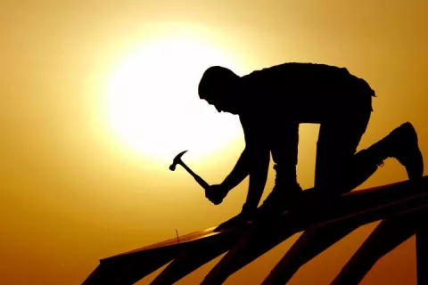 Man hammering with tools from HG Lumber & Hardware